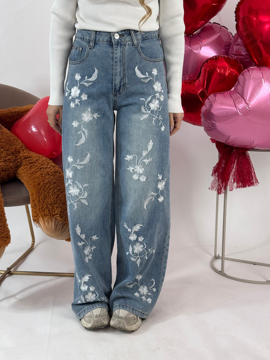 JEANS FIORI BIANCHI IN RILIEVO